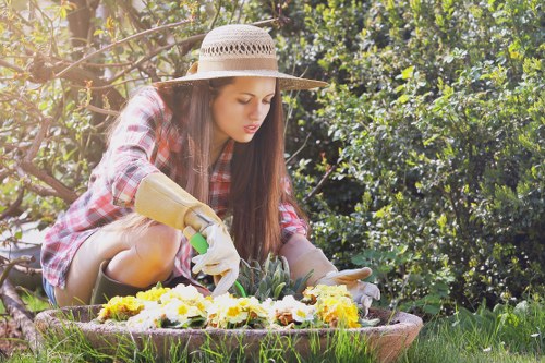 Operator applying safe plant protection in a garden area